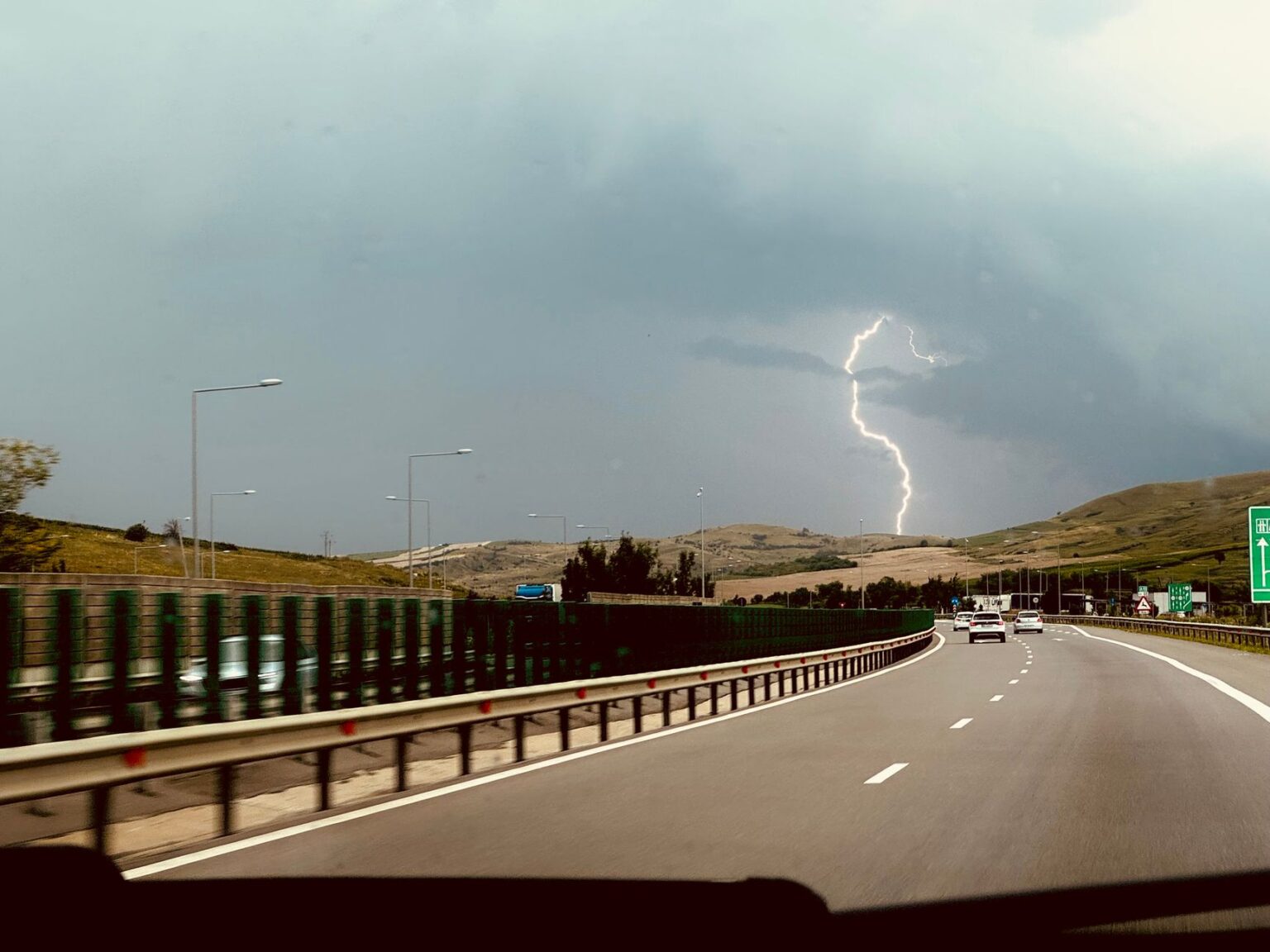 Dramatic view of a highway captured from a moving car.