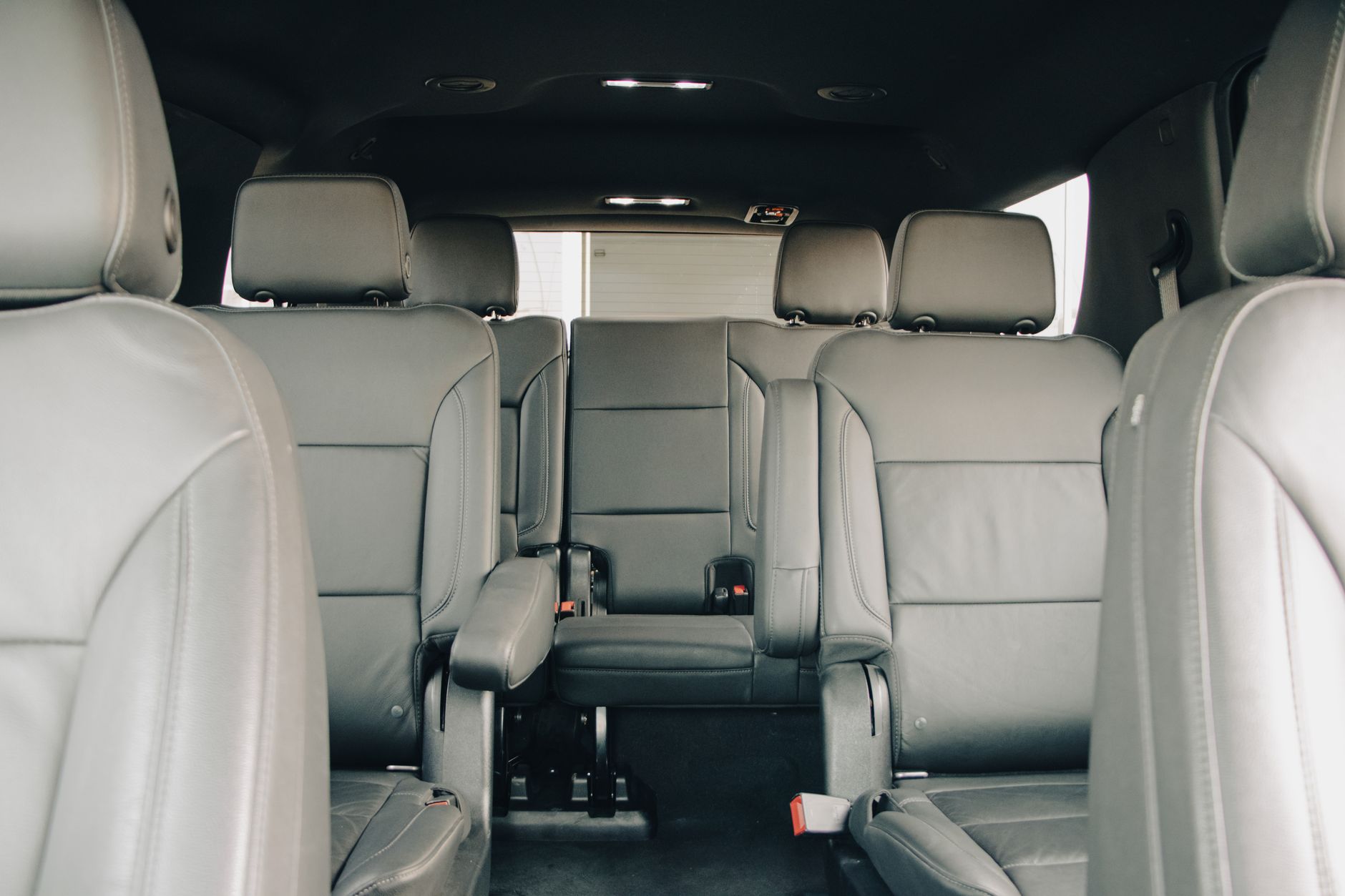 Spacious leather seats of a modern car interior.