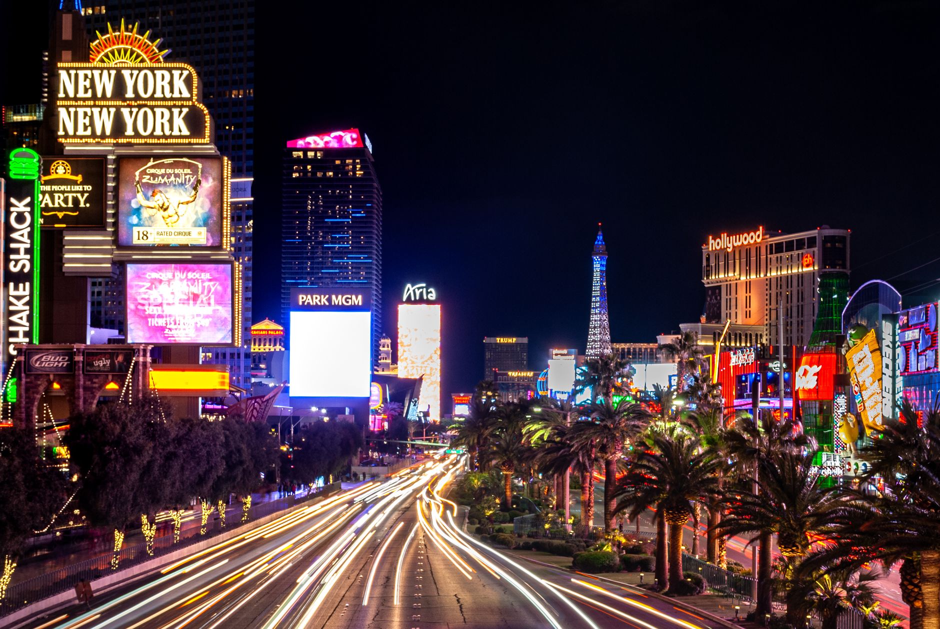 The neon lights and nightlife of the Las Vegas Strip at night.