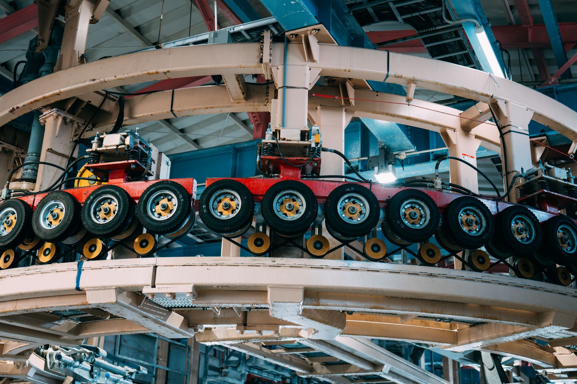 Close-up view of an industrial conveyor system inside a manufacturing facility.
