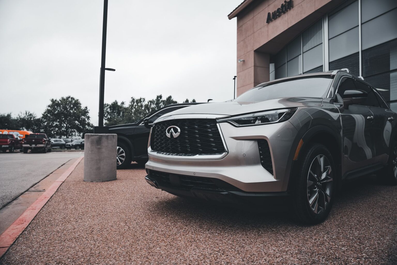 Electric SUV parked in an urban dealership setting