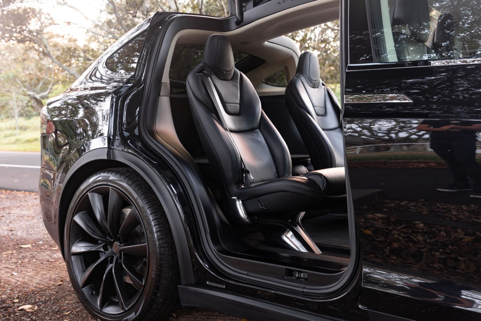 Sleek Tesla Model X with open door showcasing luxury interior in Sydney.